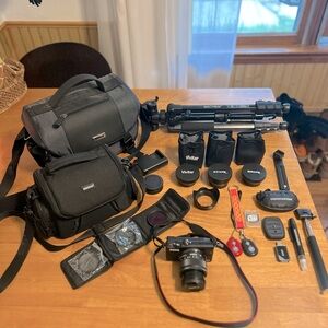 Canon EOS M100 Mirrorless Digital Camera with 15-45mm Lens, Tripod & Accessories
